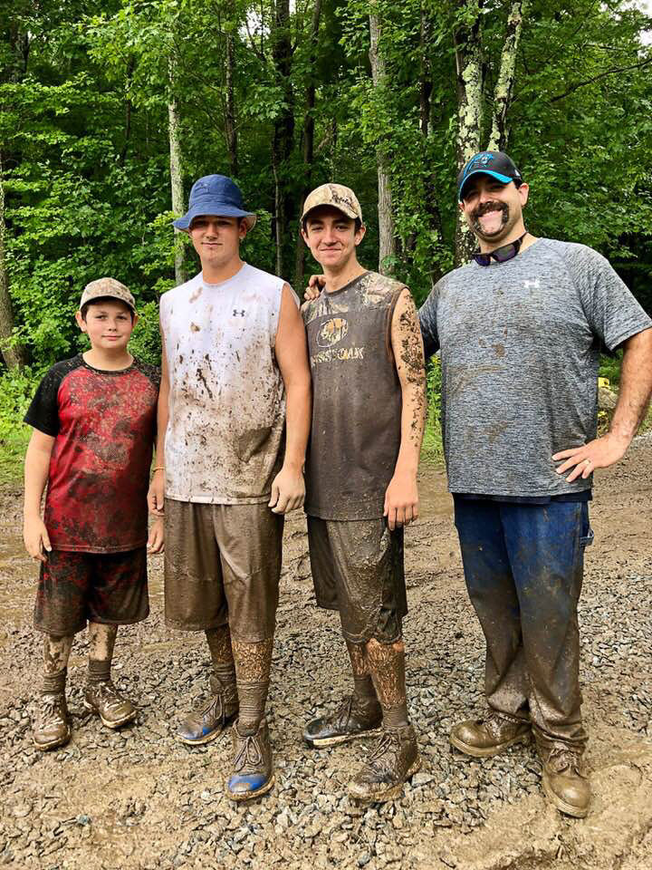 Mud Soldiers four muddy men