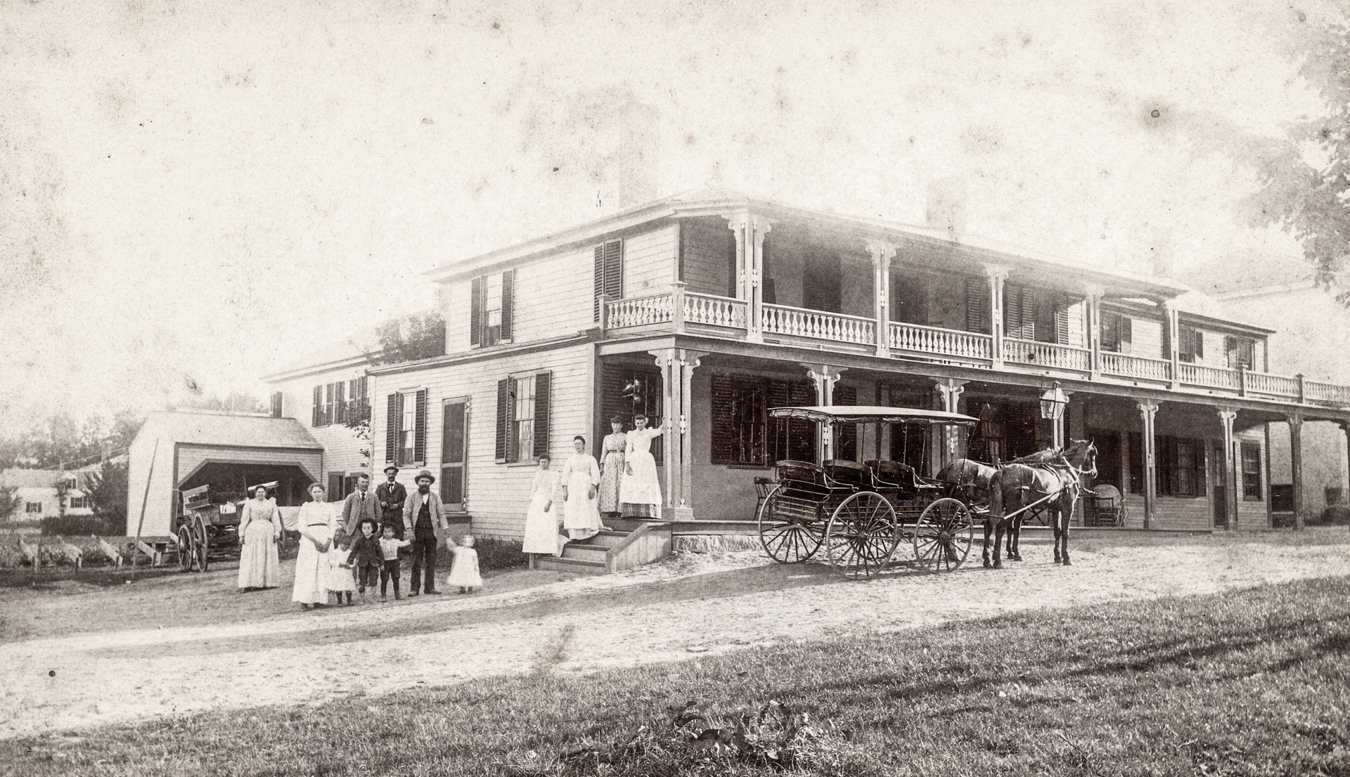 Joseph Silver with his family in front of the Clark Hotel which he owned