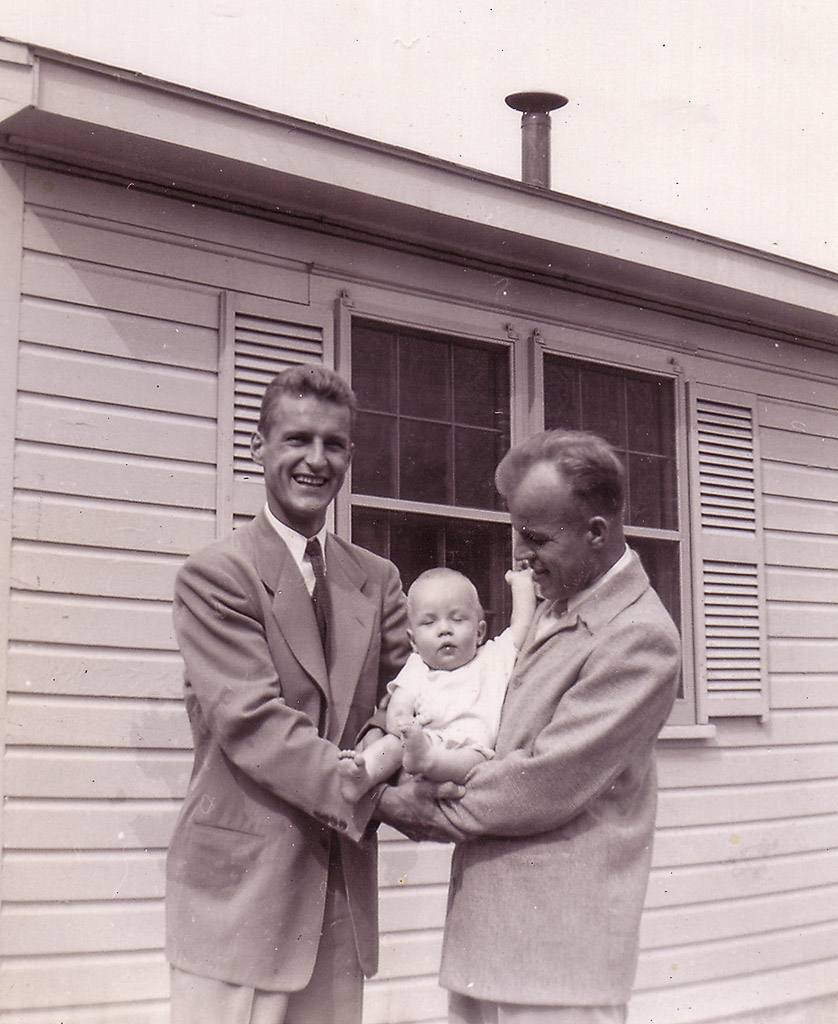 Being held by my Dad and Godfather