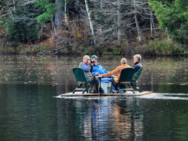 Four men on a raft