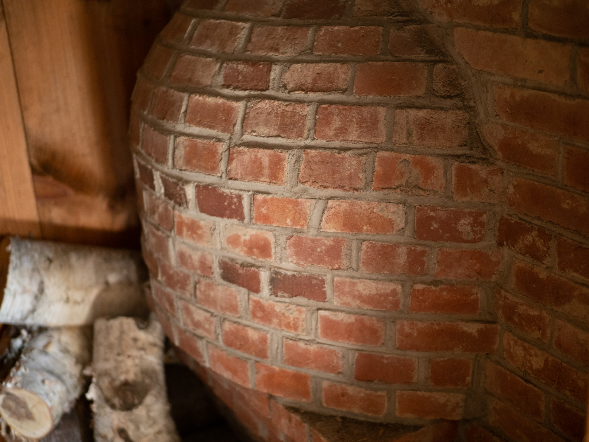 A beehive oven is built into the hearth which is used for baking pies and bread