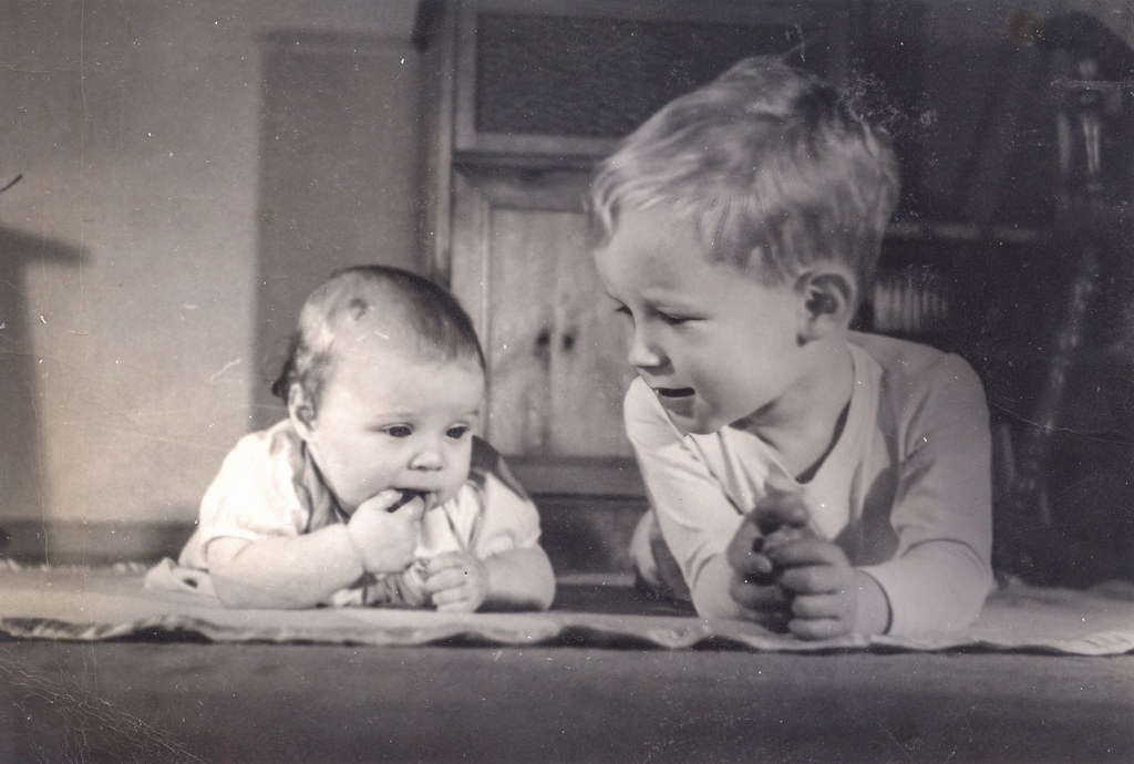Siblings on the rug circa 1950 Susan and John