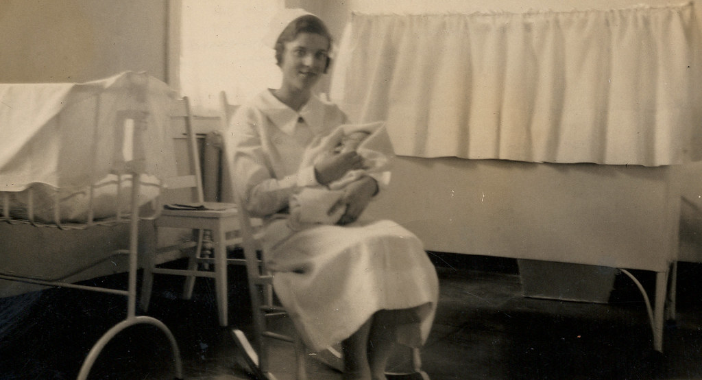 Nurse holding a baby