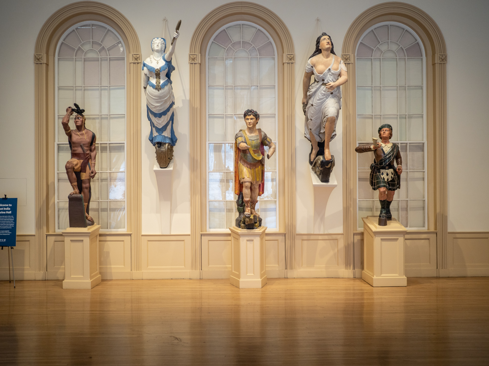 Ship figureheads at the East India Marine Society hall at the Peabody Essex Museum