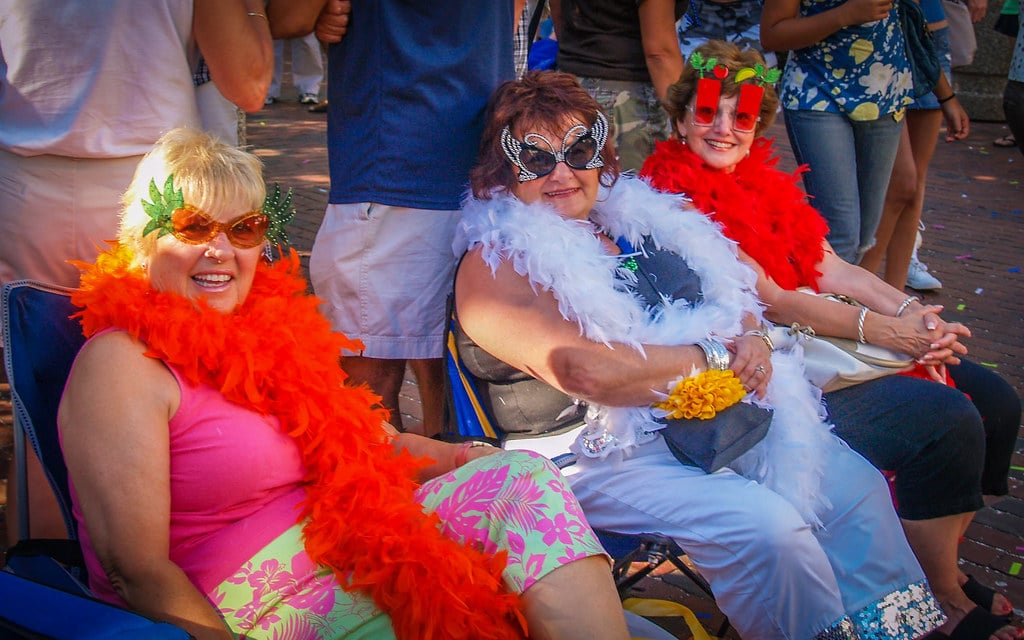 Three Ladies Three ladies wearing feathered boas