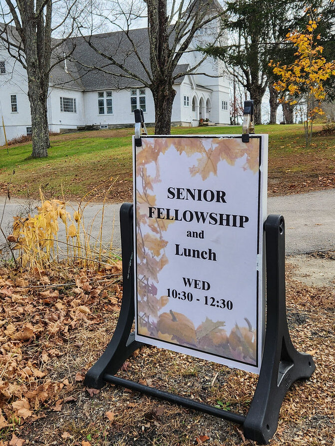 Senior lunch sign in front of the Congregational Church