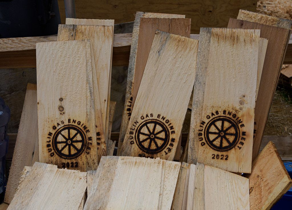 Three wooden shingles branded with name of Dublin Small Engine Meet
