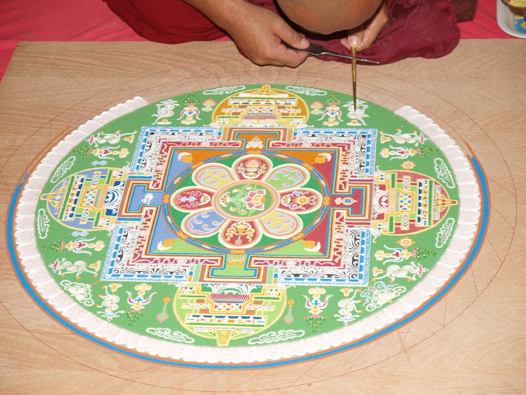 Monk creating a sand mandala